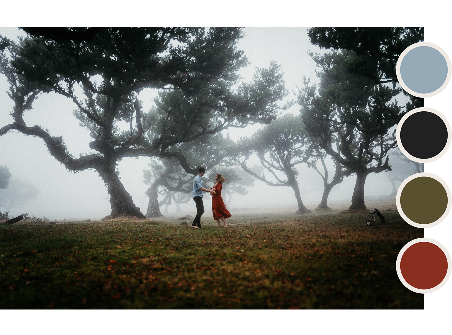 Couple is dancing in a foggy laurel forest. He is wearing dark pants and a blue button-down. She is wearing a long red dress.